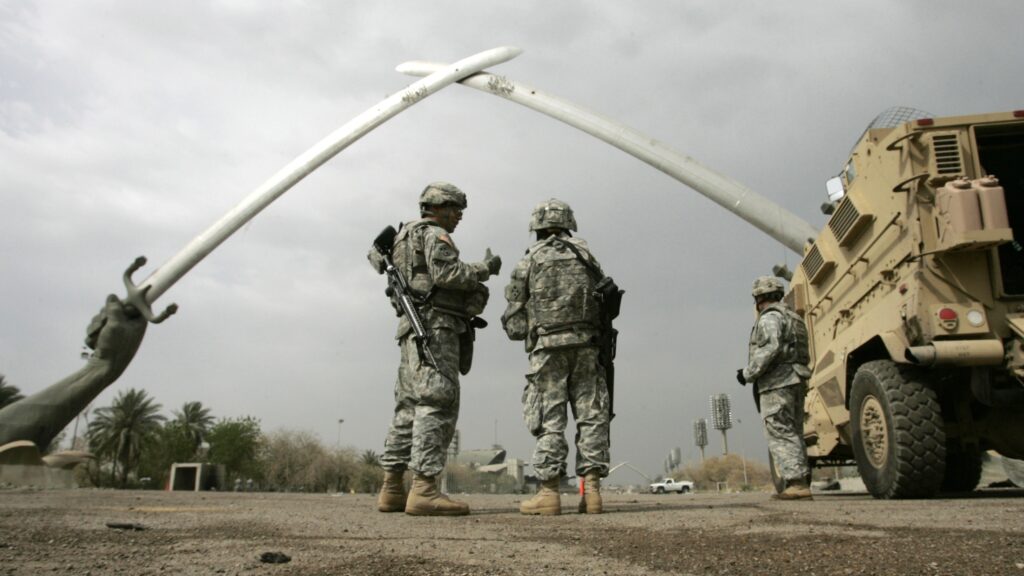 U.S. soldiers near the Swords of Qadisiyah monument in Baghdad.